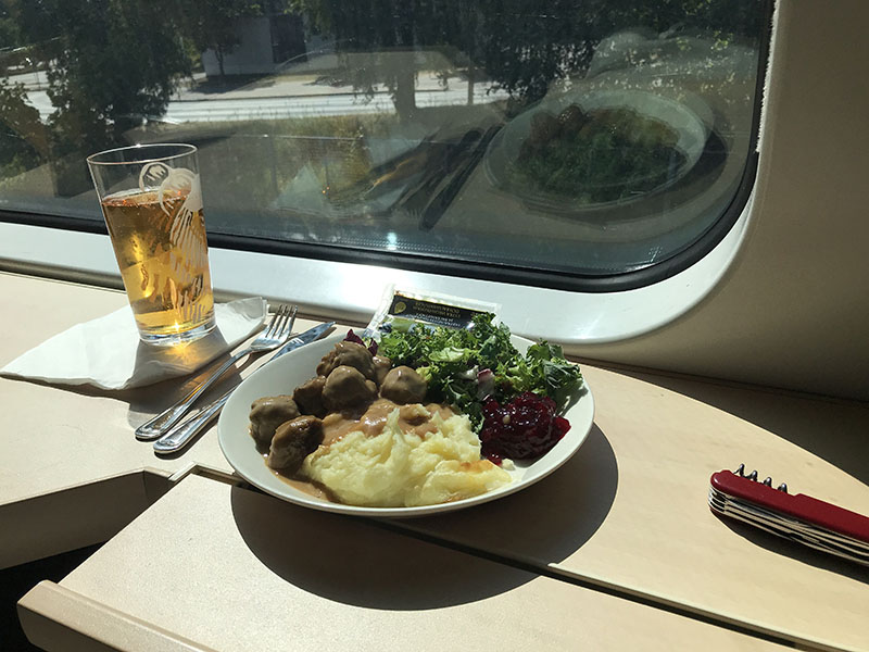 Great Looking Sunlit Meal on Finnish VR Train, Meatballs and Lingonberry Jam and Cider.